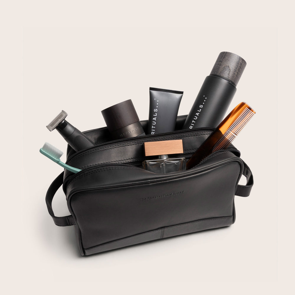 Leather Toiletry Bag Black Stacey, opened, filled with toiletries