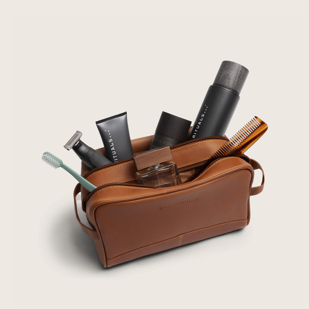 Leather Toiletry Bag Cognac Stacey, opened, filled with toiletries