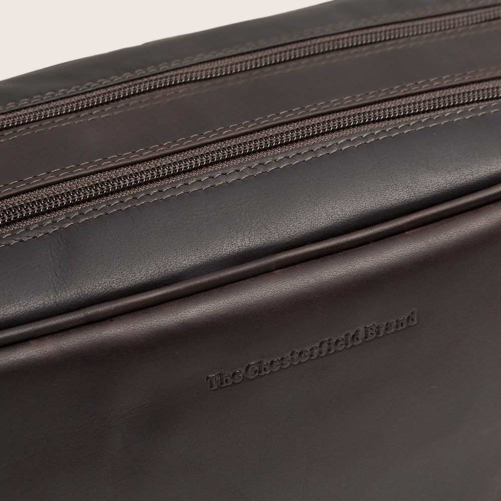 Leather Toiletry Bag Brown Stefan, close-up of the embossed logo