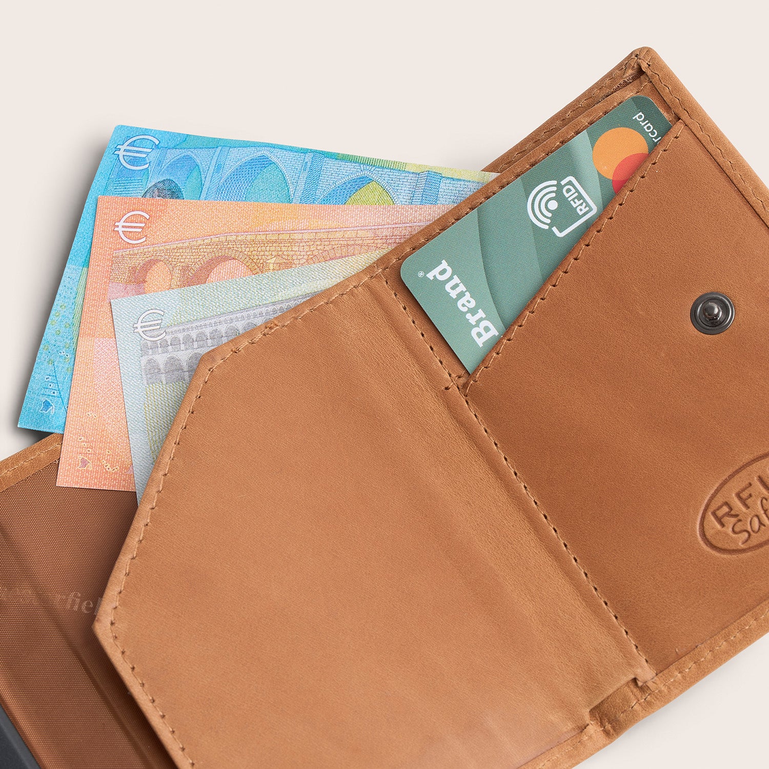 Leather Card Holder Cognac Lancaster, inside view, close-up with a card and banknotes
