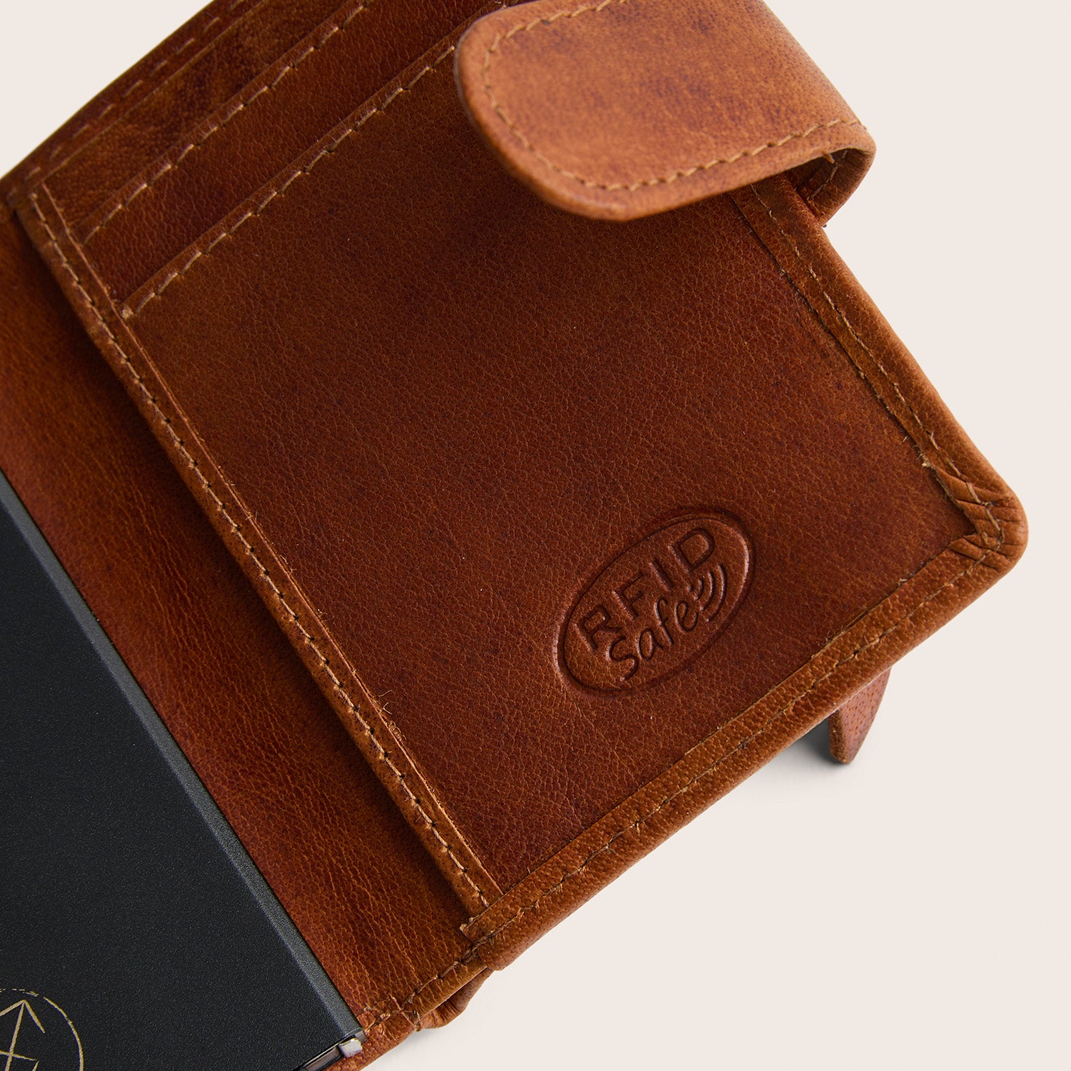 Leather Card Holder Cognac Prague, close-up of the embossed text 'RFID Safe'