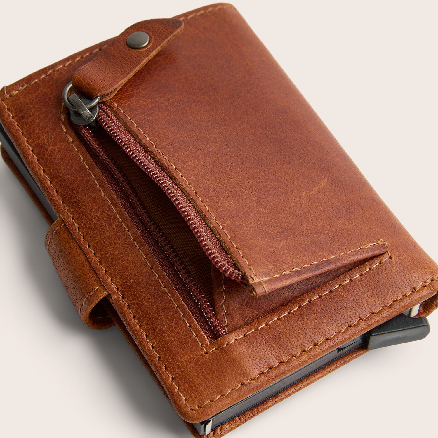 Leather Card Holder Cognac Prague, close-up of a zip pocket, opened