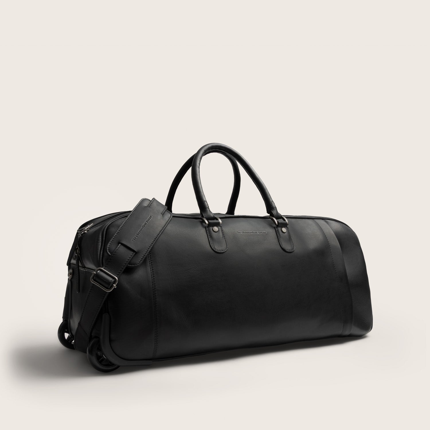 Leather Weekender Trolley Black Jayven, with shoulder strap, front view at an angle