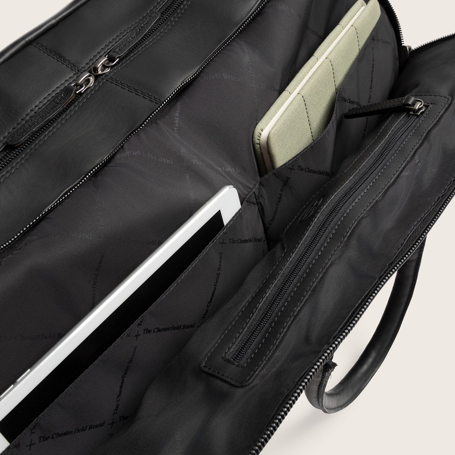Leather Weekender Trolley Black Jayven, inside view with sleeves and a zip pocket