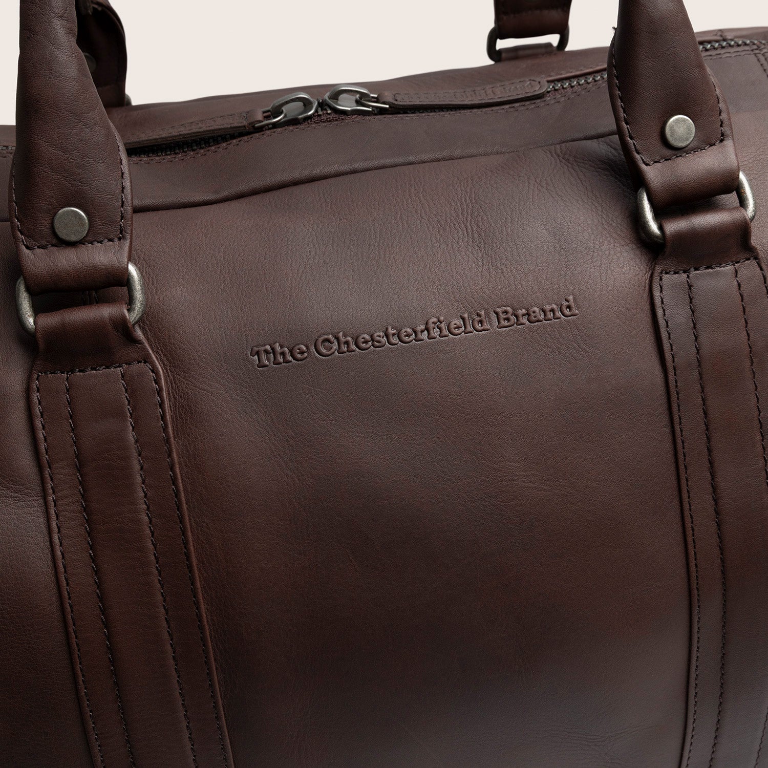 Leather Weekender Bag Brown Perth, close-up of the embossed logo