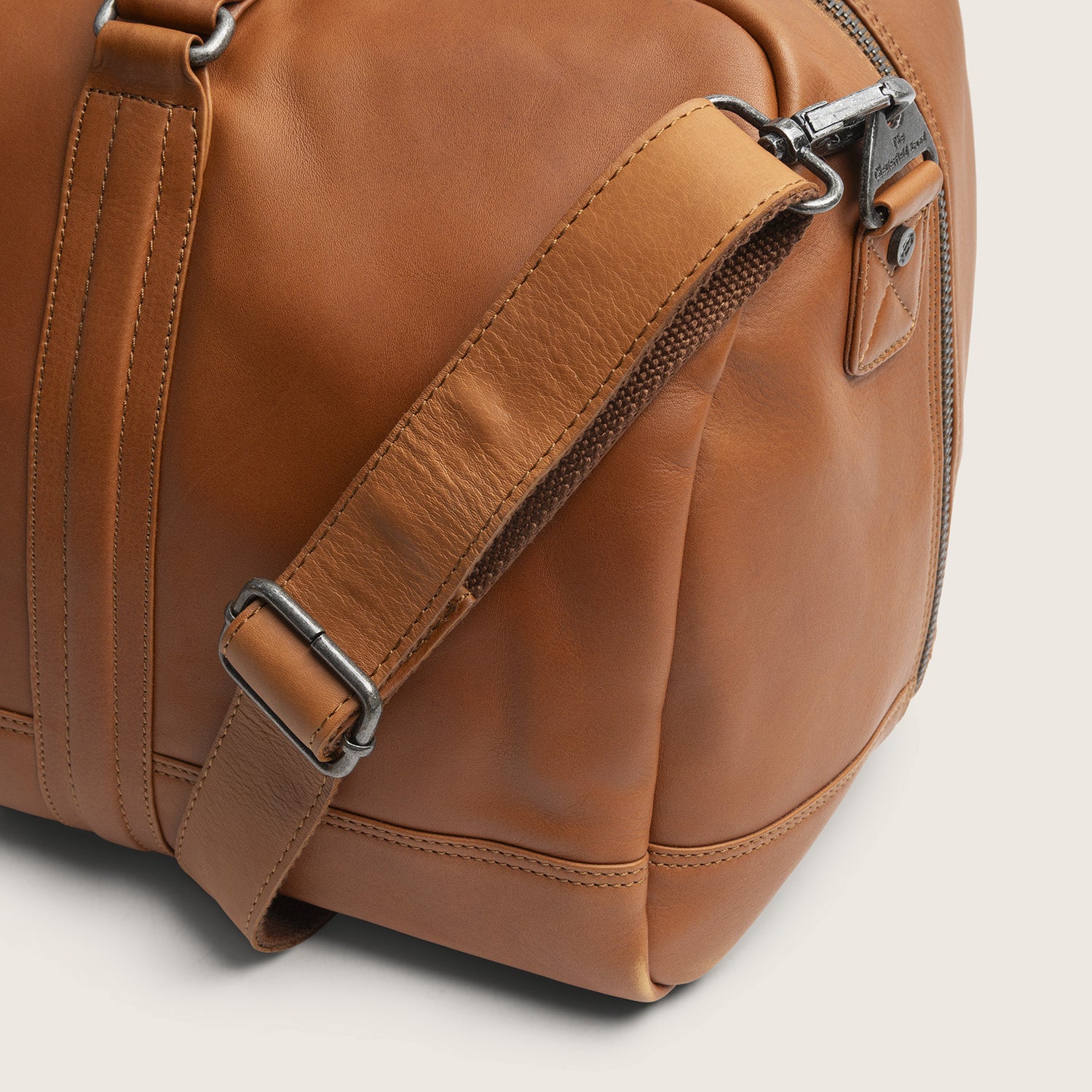 Leather Weekender Bag Cognac Melbourne, close-up of the shoulder strap
