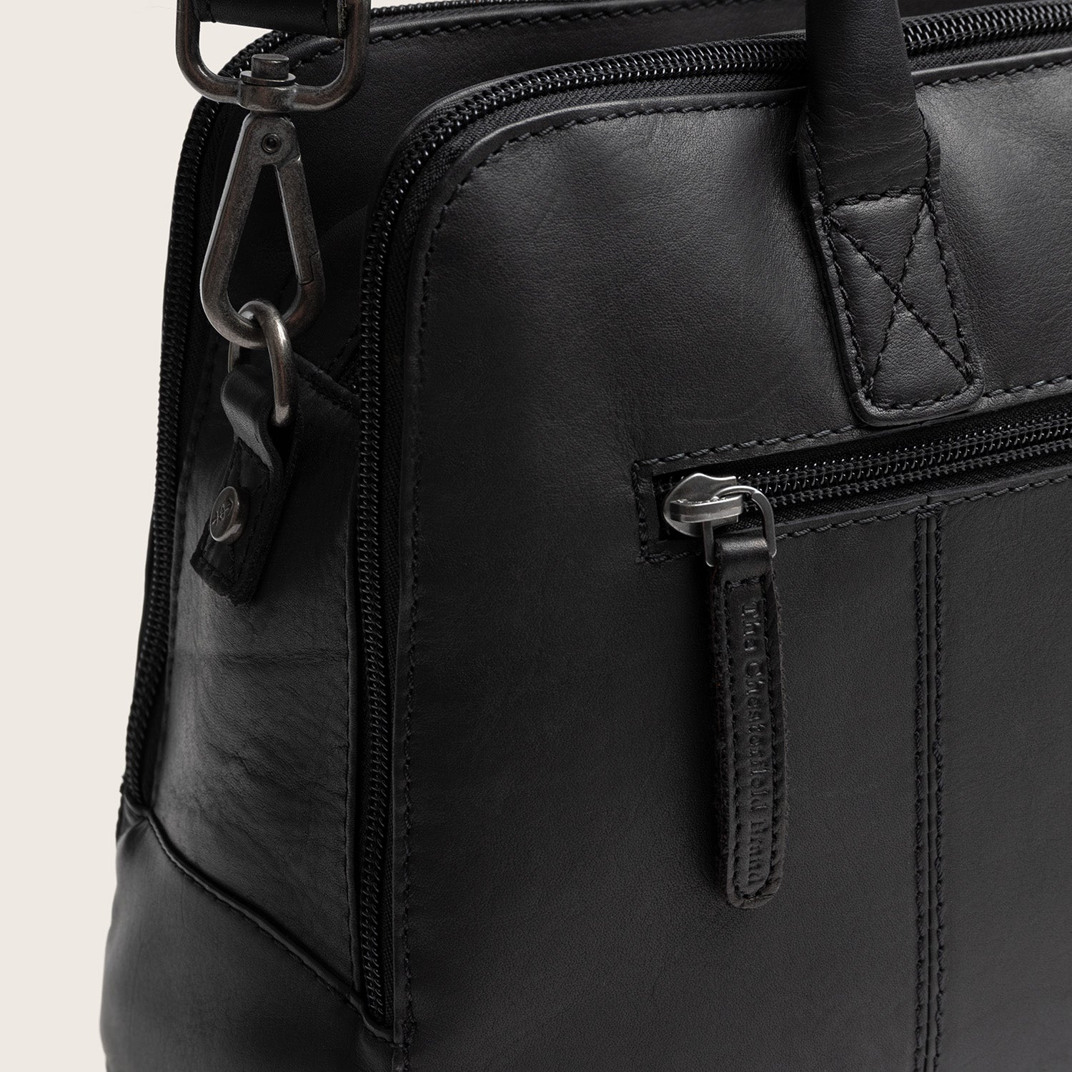 Leather Handbag Black Layton, close-up of a zip pocket