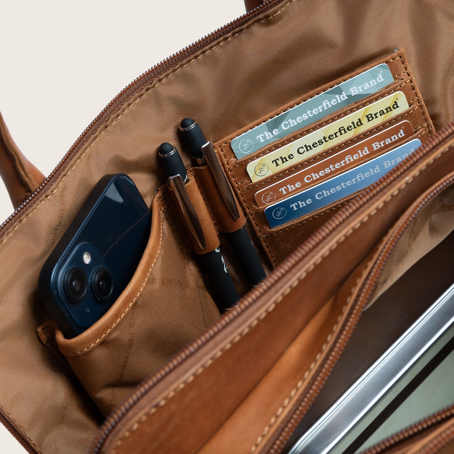 Leather Handbag Cognac Layton, inside view with card slots, phone pocket and pen holders