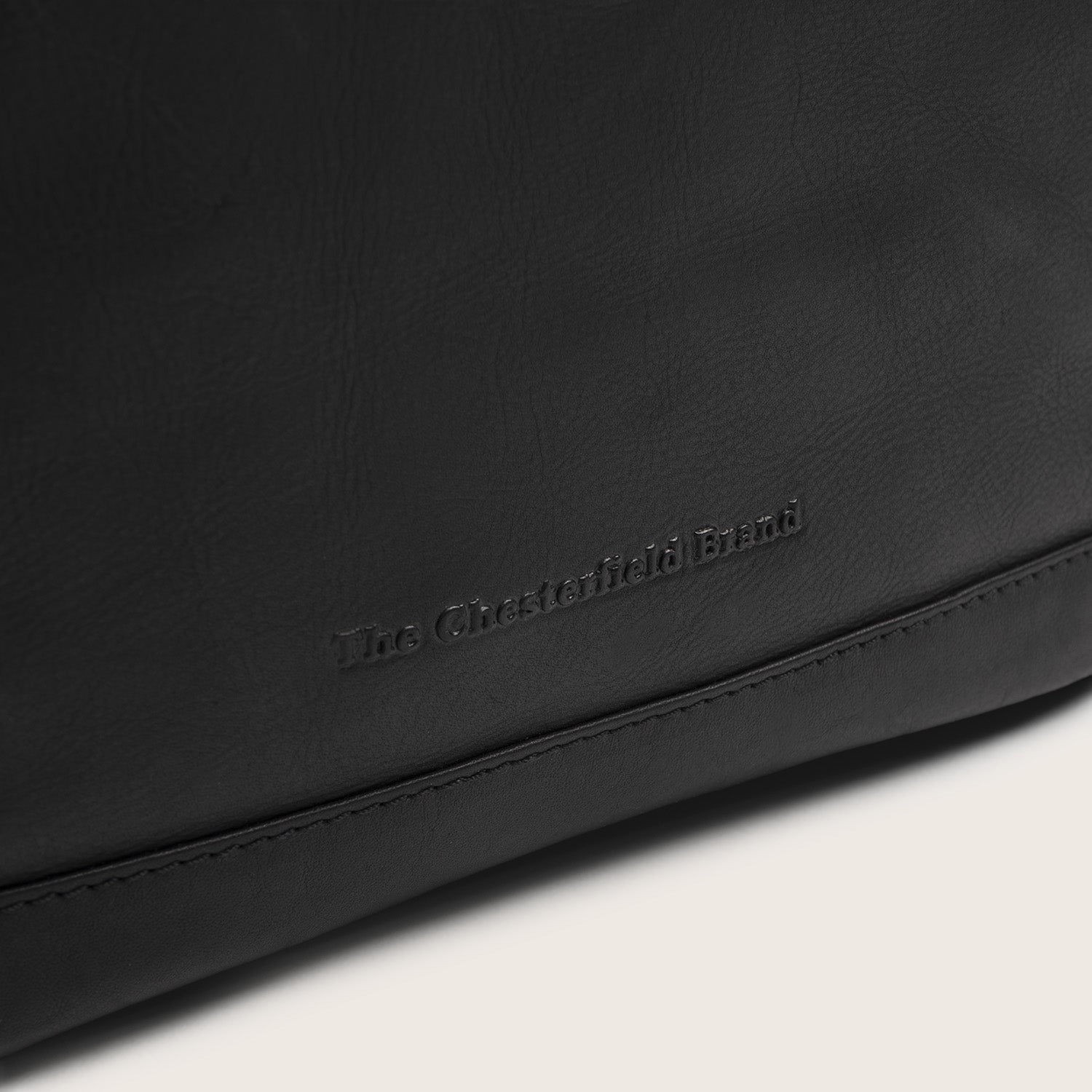 Leather Roll-top Backpack Black Mazara, close-up of the embossed logo
