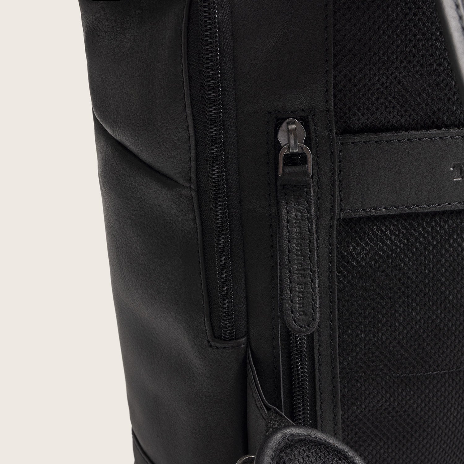Leather Roll-top Backpack Black Mazara, close-up of the side zip pockets