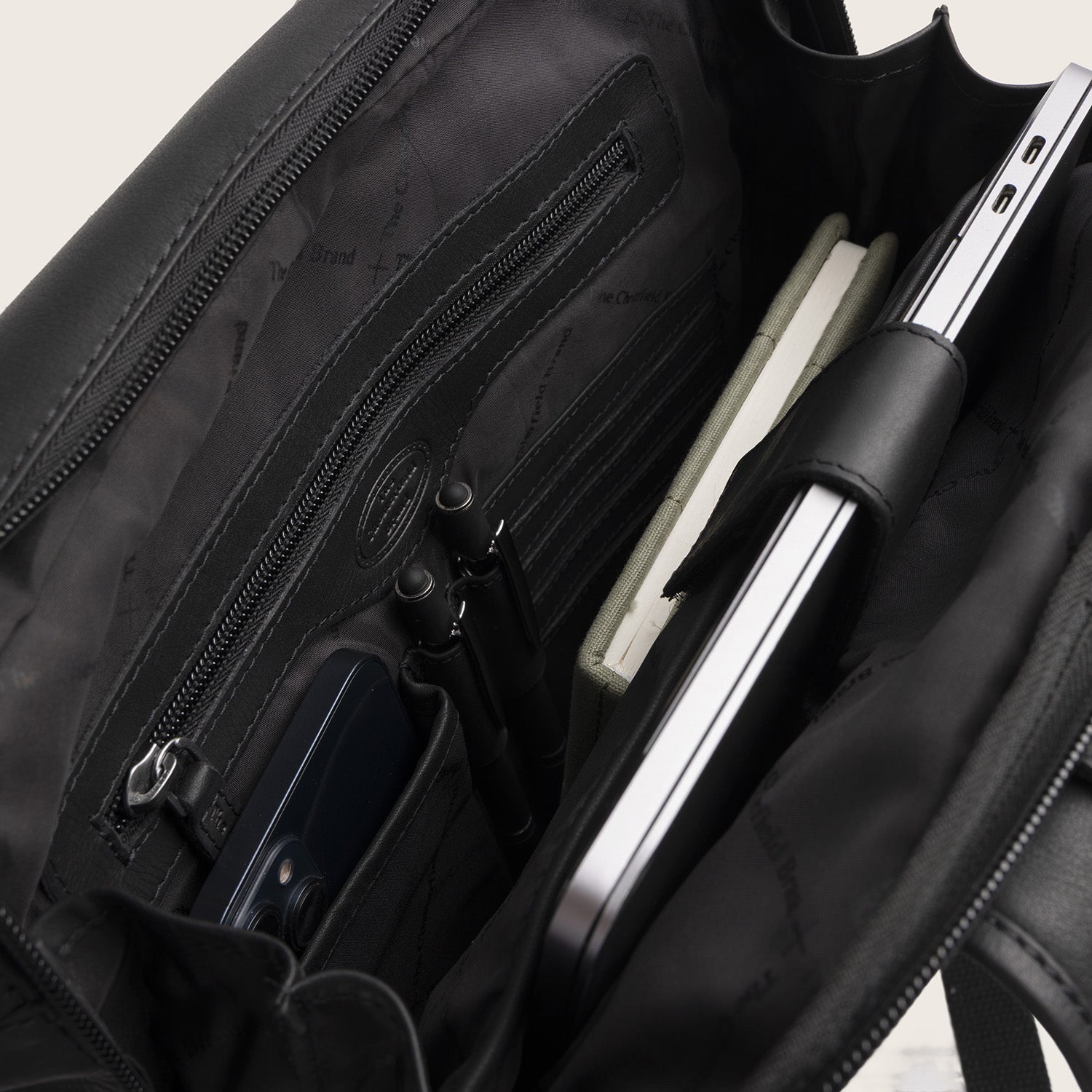 Leather Roll-top Backpack Black Mazara, inside view with organiser pockets and laptop compartment